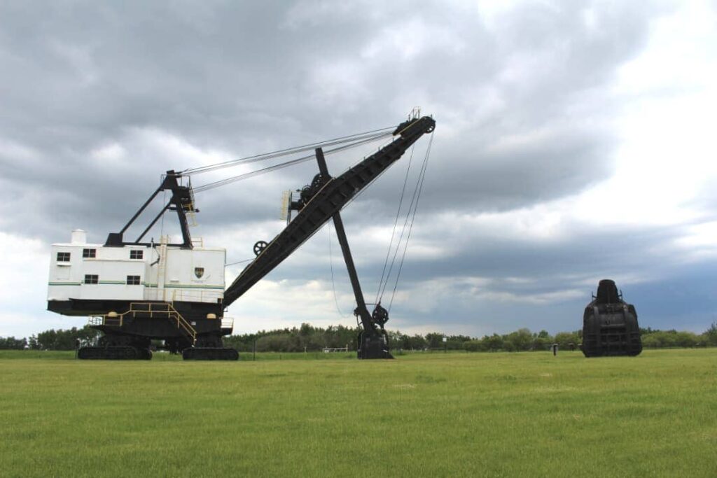 Large mining equipment sitting on grass